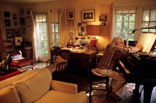 © Joe McNally. Maestro Leonard Bernstein composes at his piano on the occasion of his 70th birthday, at his home in Connecticut, USA.