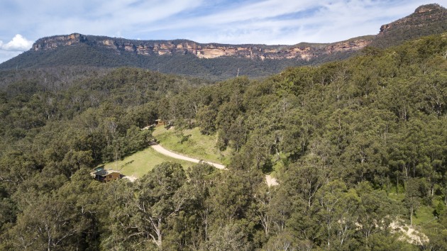 An aerial view of the new cabins with the Blue Mountains escarpment in the background. A. Crockett & S Cottrell/DPE