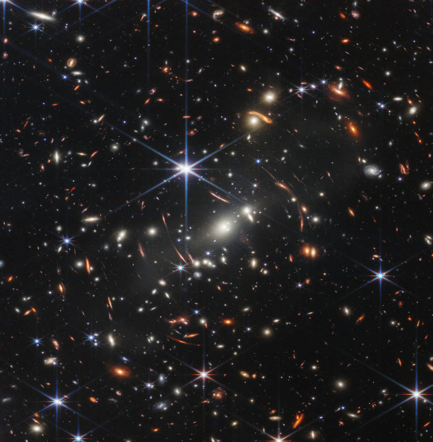 Thousands of galaxies – including the faintest objects ever observed in the infrared – have appeared in Webb’s view for the first time. This slice of the vast universe covers a patch of sky approximately the size of a grain of sand held at arm’s length by someone on the ground. Image: NASA