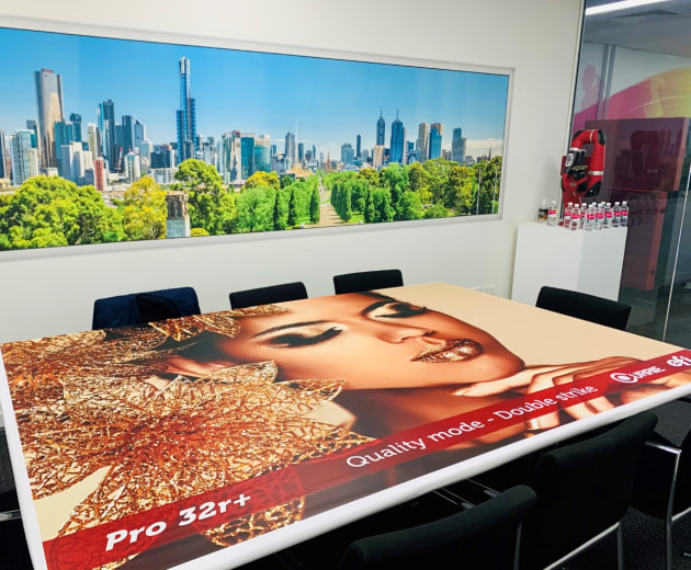 Wide format in the Currie Group meeting room: on the table, and the wall