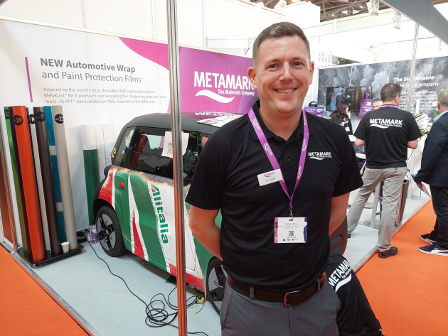 Sustainable: Dan Sefton, Metamark, with a car being wrapped on stand