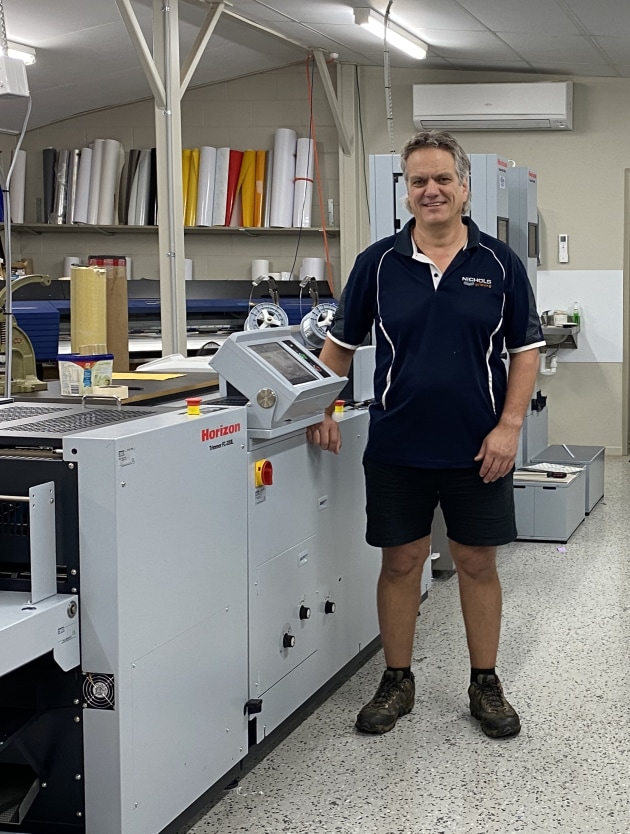 In-house flexibility: Andrew Niochols with the company's new Horizon 200L bookletmaker and twin VAC-1000 collating towers