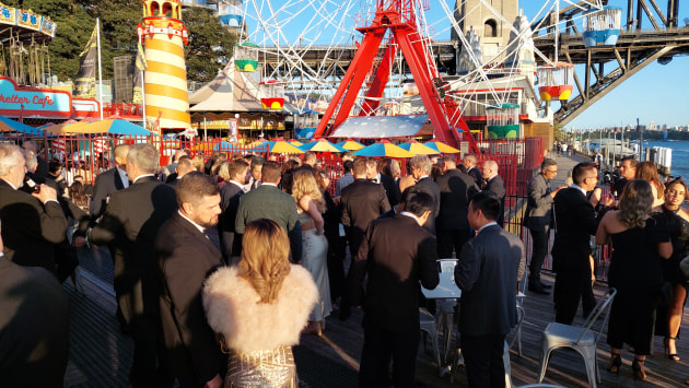 On the terrace: Guests mingle before the dinner