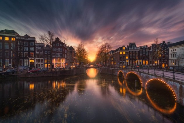 This photo was planned with Photopills to align the sunset exactly at that time of year. I used the WeatherPro app for the weather forecast (clouds) and the wind direction to get this vortex shot of the Amsterdam canals with the sunset exactly in the middle of the bridge.