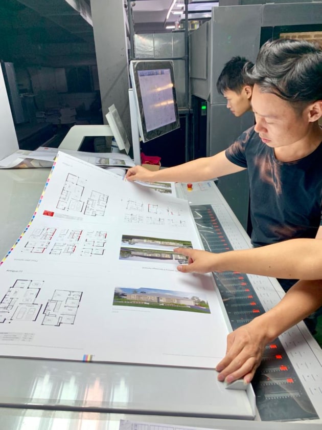 China checking: Domain brochures print being checked on the press in China