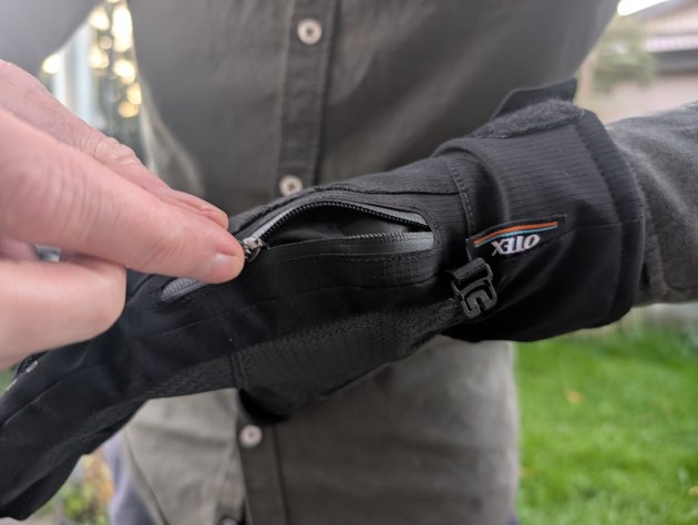 The gloves have lots of neat little features. This pocket on the top of both gloves can hold things like credit cards, SD cards, or even Otex's own handwarmers. Image: Mike O'Connor