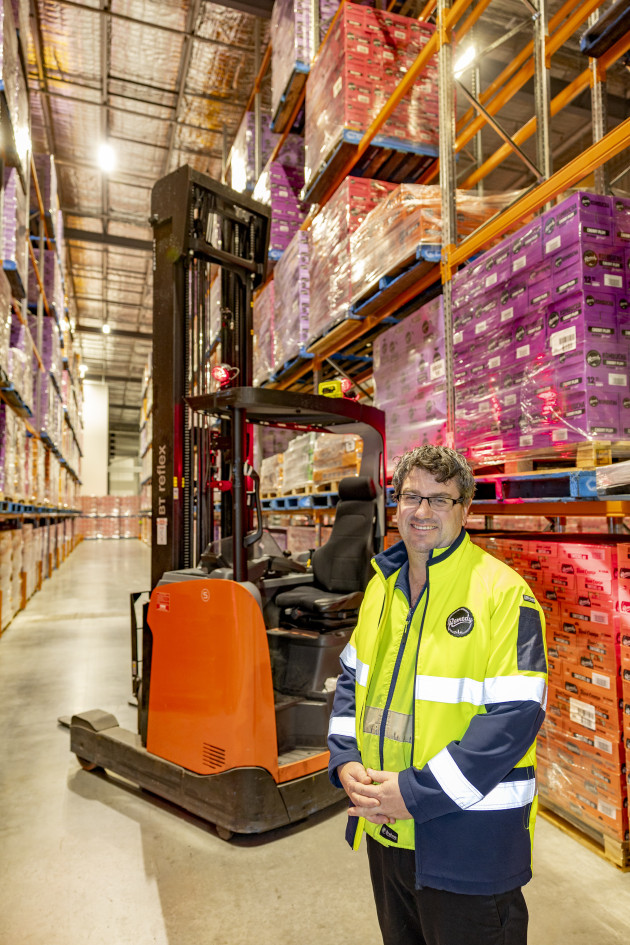 Remedy Drinks warehouse manager Ryan Stark with one of the company's eight TMHA forklifts.