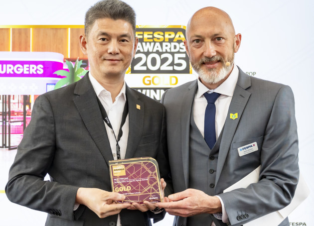 Fespa Global winner: Romeo Sanuri, Next Printing, (left), receives Fesap Gold from Duncan MacOwen, head of marketing and events, Fespa