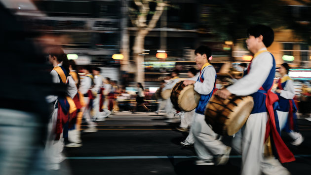 © Dylan Goldby - With the number of moving objects in this scene and the erratic nature of their movement, there was no way I would be able to get them sharp. By embracing this and knowing that the feeling of this constant procession would be conveyed, I slowed my shutter down and made several frames as the drummers passed my seat. Fujifilm GFX 50R + GF 45mm f/2.8, f/2.8, 1/10, ISO 320.