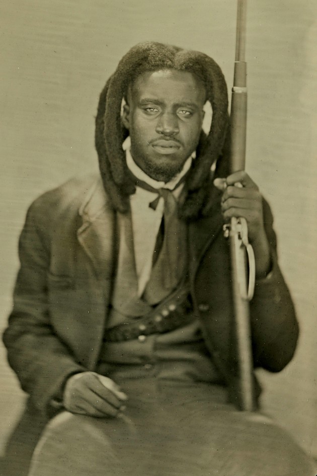 The award winning musician Shaboozey.The postcard sized silver metallic positives look incredibly detailed with super-fine grain.Traditionally, the long exposures meant the sitter had to be ‘locked in’ using a head brace, while ‘holding’ a smile might blur the mouth. Image © Conrad Young.