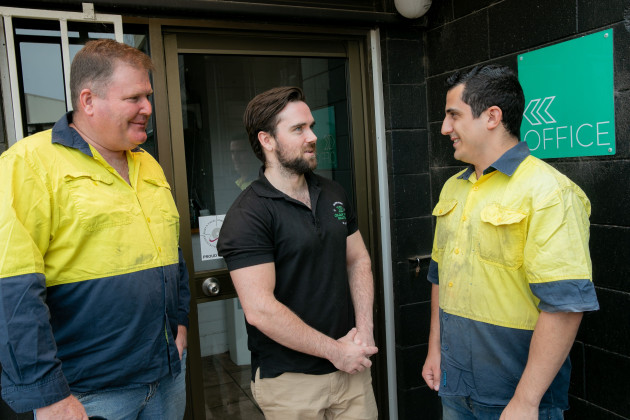 Disruption: Adam Smith at Colour Print Solutions in fire-affected Bulli (centre) talks with PVCA CEO Andrew Macaulay and PVCA finance manager Matt Schembri