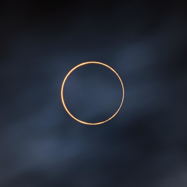 © Shuchang Dong. The Golden Ring. Astronomy Photographer of the Year 2021 overall winner.
The image shows an annular solar eclipse taken in the Ali region of Tibet. "This place has year-round sunny weather, but in front of the annular eclipse, I saw dark clouds all over the sky. We were waiting with anxious minds but we were lucky. Within a minute of the annular eclipse, the sunshine penetrated through the clouds and afterwards the Sun was sucked into the thick clouds. We were so lucky here!”