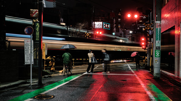 © Dylan Goldby - Tokyo, like many other Asian megacities, does not stop. Things are constantly in flux and people are constantly on the move. This image of a train speeding across a railway crossing gives a good example of a shutter speed that could freeze the pedestrians patiently waiting to cross while the moving train gets blurred into stripes of light. Fujifilm X100F, f/8, 1 second, ISO 200.