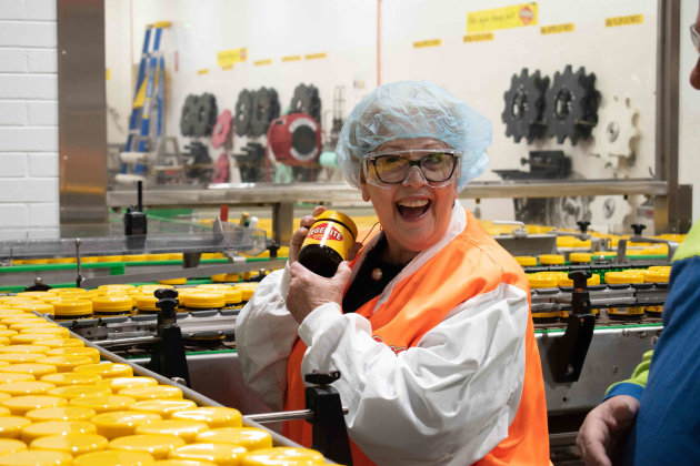 As Vegemite turns 100, one of the original Happy Little Vegemites from its first TV commercial, Trish Cavanagh, was given a tour of the Vegemite factory, which has been on the same site since the first jar rolled off the line.