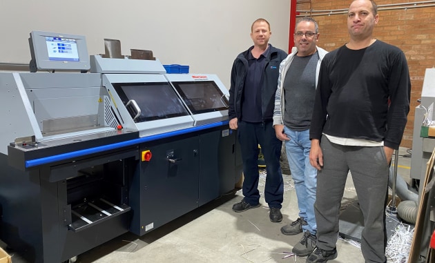 new Horizon BQ-270 at Westman: With the binder are (l-r) Tyson McDivitt, Currie Group; Tony Centorrino, production manager; and Adrian Burger, bindery operator