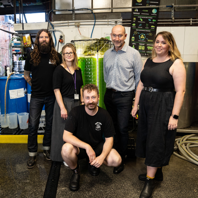 In 2020, Young Henrys (YH) started a carbon emission reduction project with UTS' Climate Change Cluster (C3), using algae to capture CO2. 
YH co-founder Oscar McMahon (left), head brewer Jesse Searles (Centre) and the team from C3.