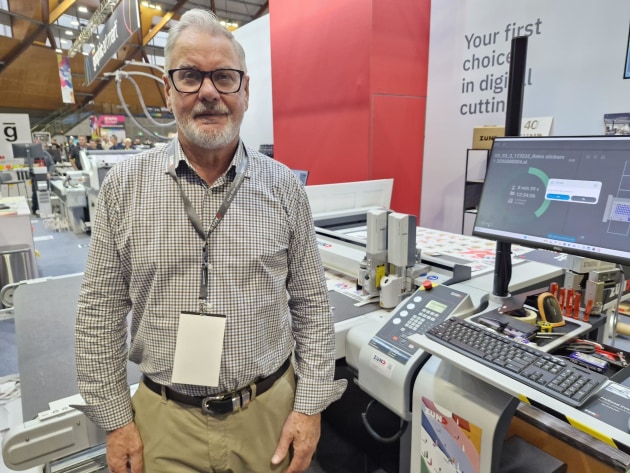 Precision cutting: Dale Hawkins with the two Zund cutting systems on the stand