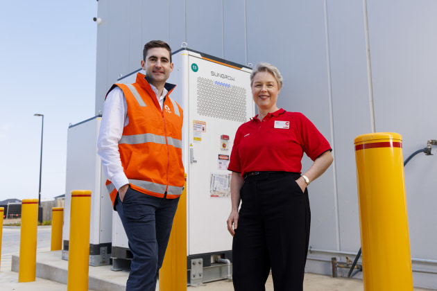 (l-r) Origin Liam McWhirter and Coles' Jane Mansfield with the Orana Village backup battery.
