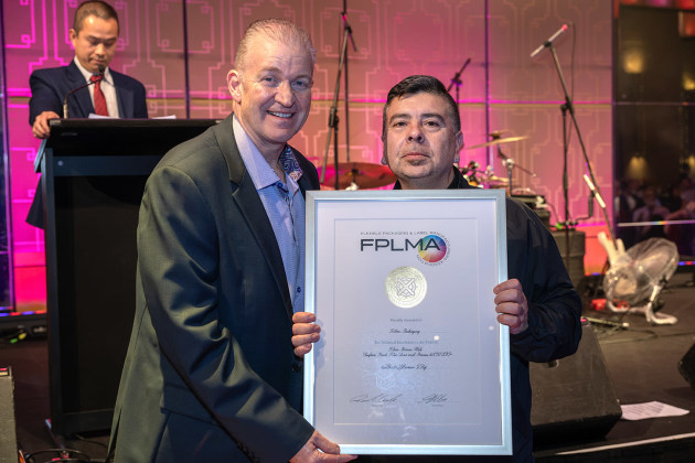 Filton printing team leader Marco Romero (right) receives the award.