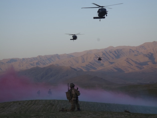Khod Valley, Afghanistan 2011. Up at 0400 and after 8 straight hours of combat operations in enemy dominated territory, the sound of US Blackhawks was most welcome. However, our work was not complete. After 2 hours crammed inside an overloaded helicopter, we reacted to a high value target who presented on the way home. Within an hour of extraction out of the Khas Uruzgan area the troop were conducting more operations very close to sunset. Just another long day.
Photo by Harry Moffitt.