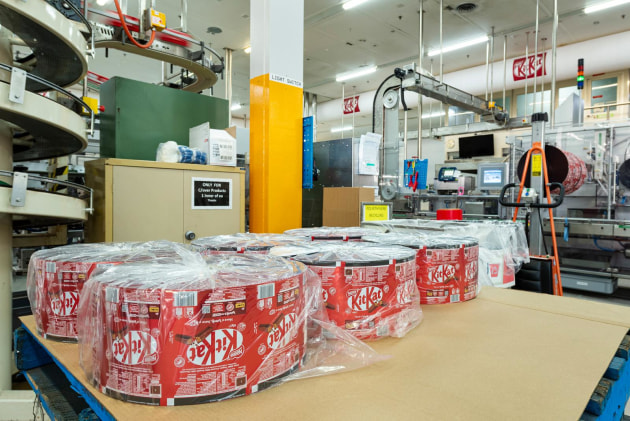 Reels of the flexible material containing PCR PP ready to convert into KitKat wrappers.