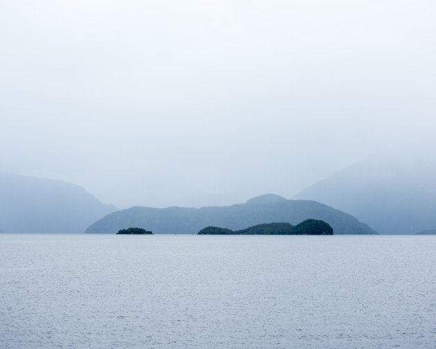 Doubtful Sound, Fiordland, New Zealand. The islands and hills blend into one as mist simplifies this complex landscape, reducing it to a series of layered tones receding into the distance. Nikon D810, Nikkor 70–300mm lens @ 70mm, 1/800s @ f5.6, ISO 400.