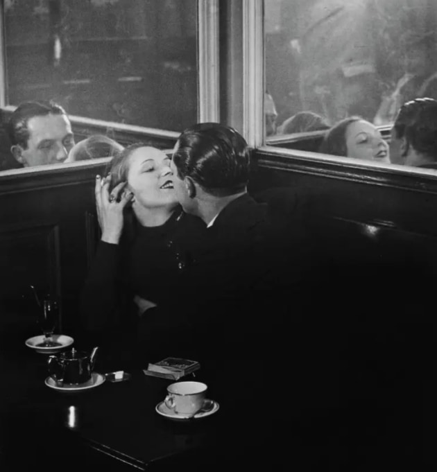 Brassaï, Couple d’amoureux dans un petit café parisien, quartier Italie (Couple of lovers in a small café on Place d’Italie) c.1932, gelatin silver photograph © Estate Brassaï, Succession/Philippe Ribeyrolles