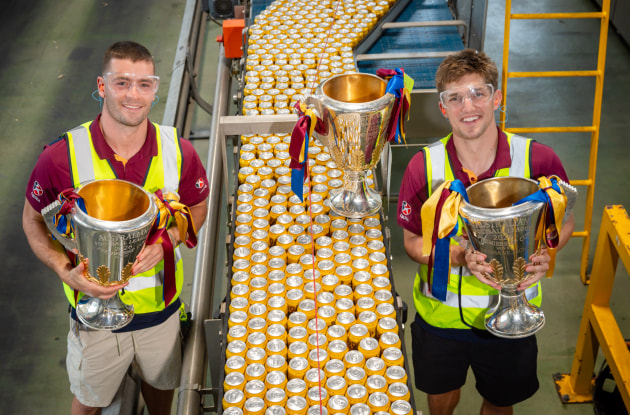 Josh Dunkley and Zac Bailey with all 3 Premiership trophies at the brewery.