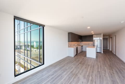 Contemporary Living Room With Large Windows at 10 Clay Apartments in Seattle, WA