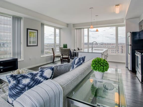 Charcoal wide plank flooring Spacious open layouts with charcoal wide plank wood flooring in the B5 Floor Plan at Waterside Place by Windsor, 505 Congress St, Boston
