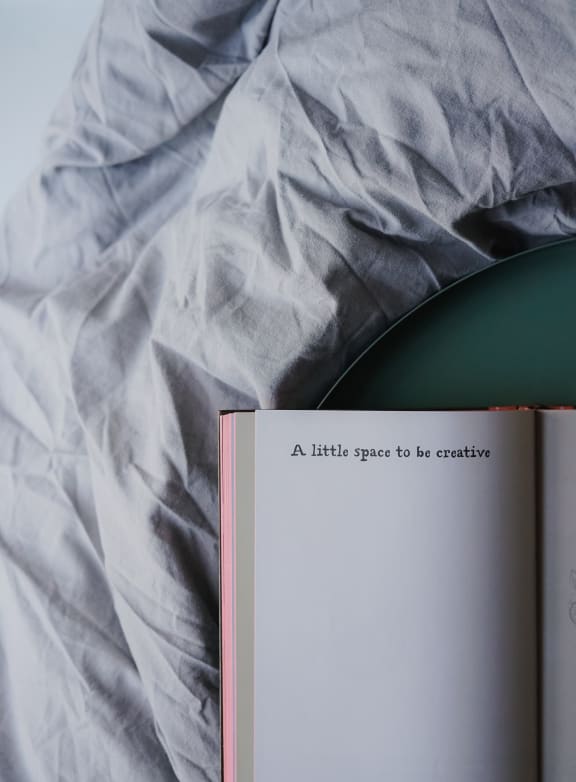 Reading in Bed at Knollwood Meadows Apartments, Santa Maria, CA
