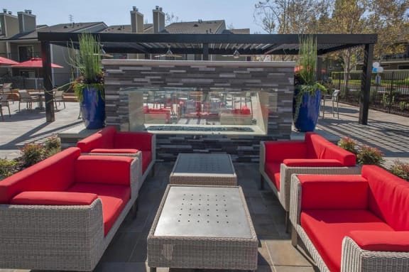 Kirker Creek l Fireplace Fireplace seating Apartments in Pittsburg-Kirker Creek in CA Pool Lounge