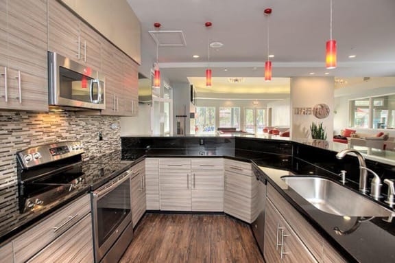 Kirker Creek l The Hub Large Kitchen in game area Apartments in Pittsburg, CA l Kirker Creek Apartments
