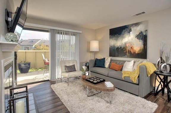 Kirker Creek l Living Room Living Room with patio Pet-Friendly Apartments in Pittsburg CA -Kirker Creek Living Room
