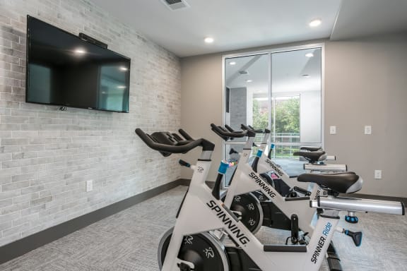 High-Tech Fitness Center With TV at Azure Houston Apartments, Texas