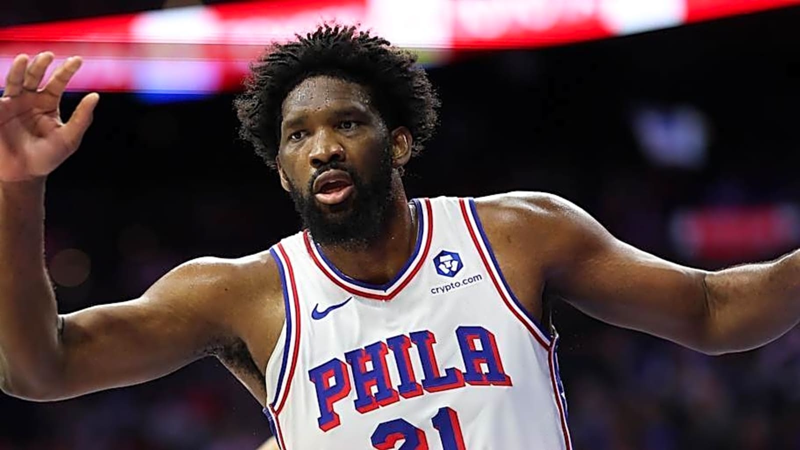 Joel Embiid wearing a white Philadelphia 76ers jersey during NBA action