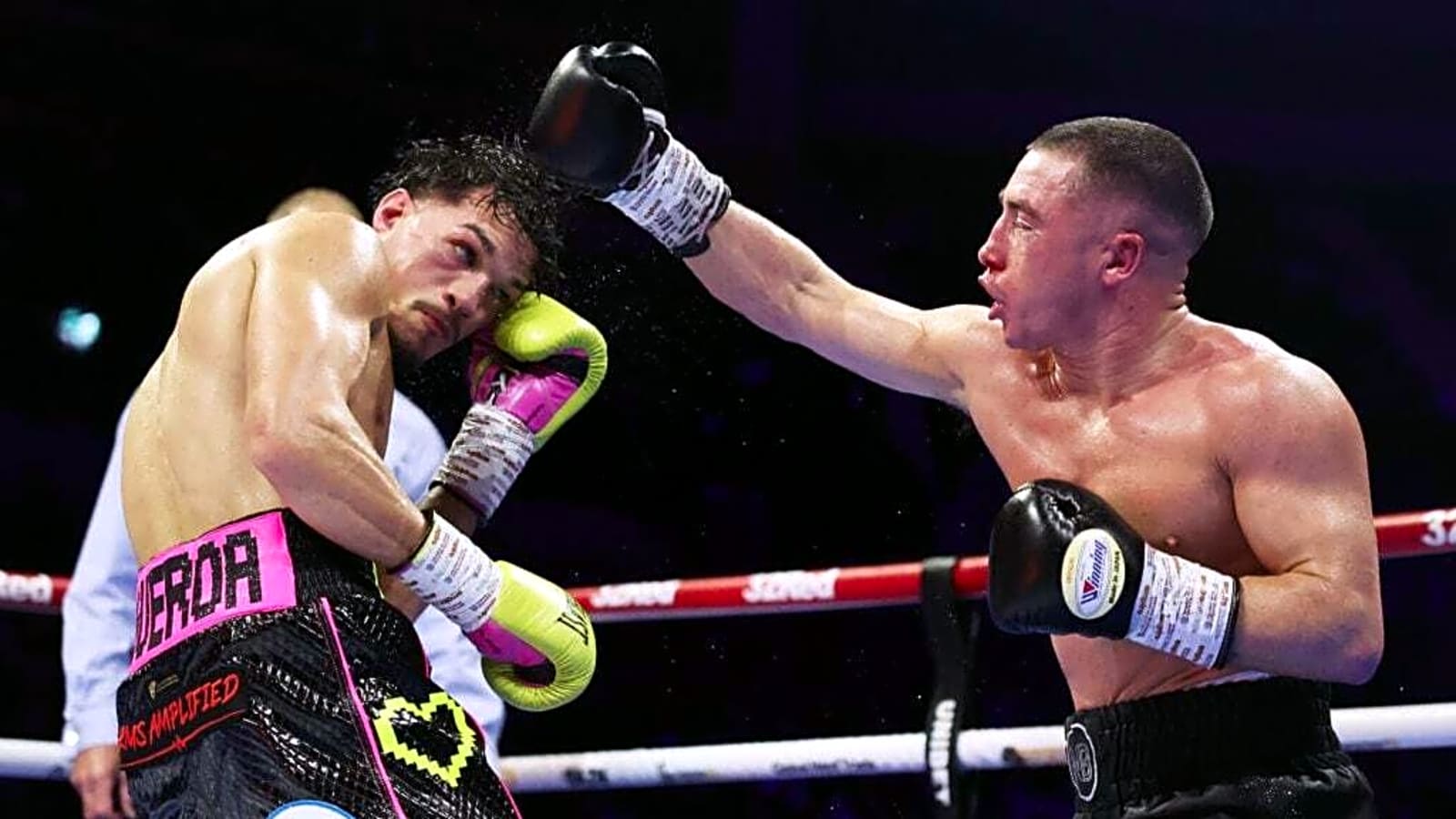 World title bout ends in chaos as boxer storms ring and throws kick ...