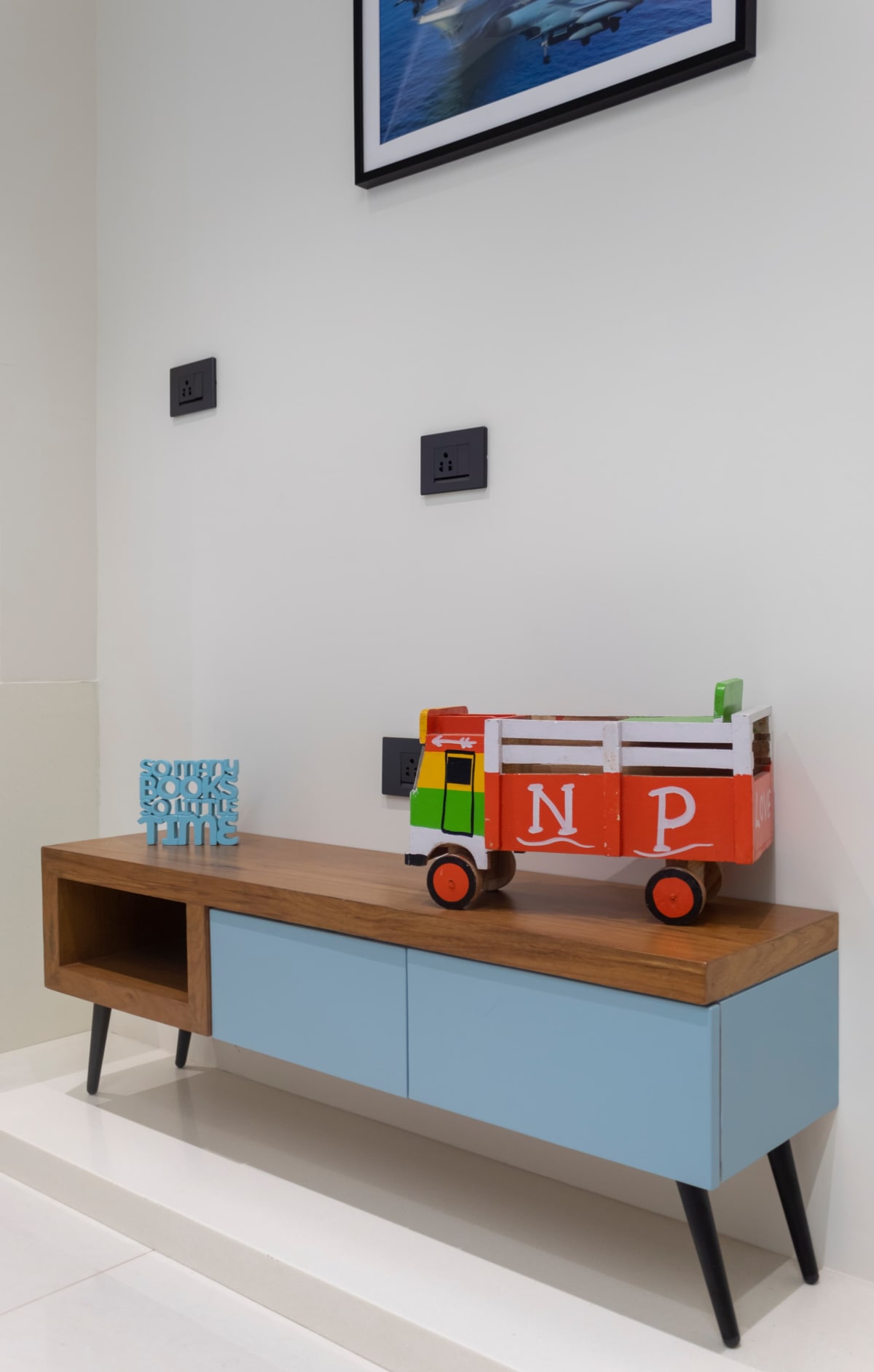 Wooden and blue console with toy truck