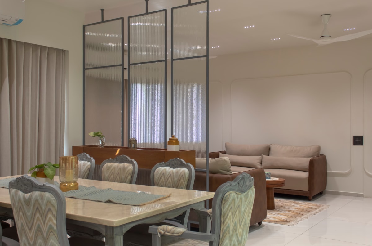 Open dining and living room with glass screen divider