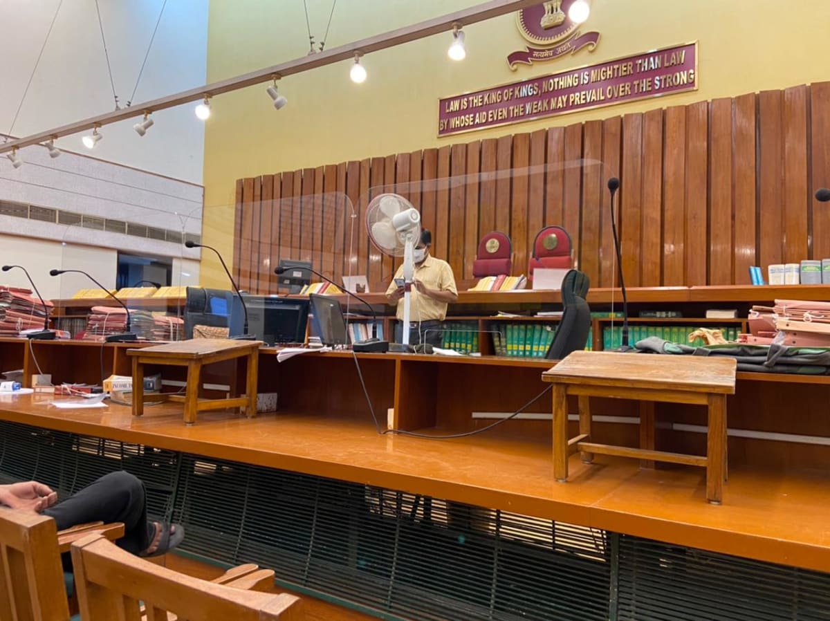 Courtroom with wooden paneling and judge's bench