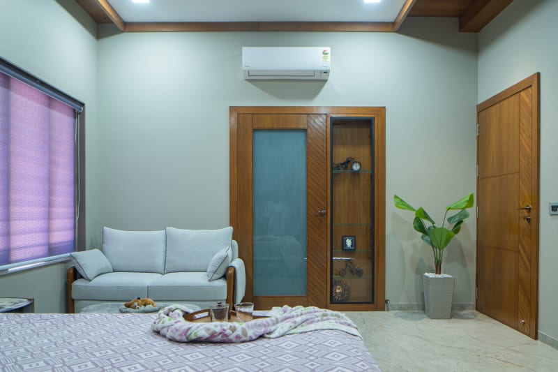 Cozy bedroom corner with sofa and doors