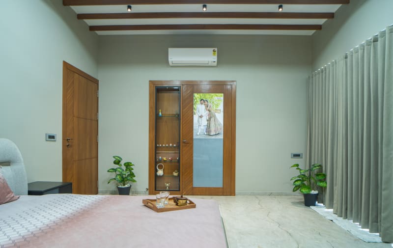 "Bedroom view with wooden doors and cabinets"