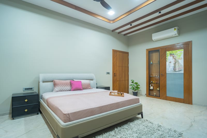 "Spacious bedroom with double bed and doors"
