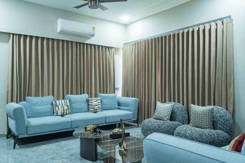 "Light blue sofa in modern living room"