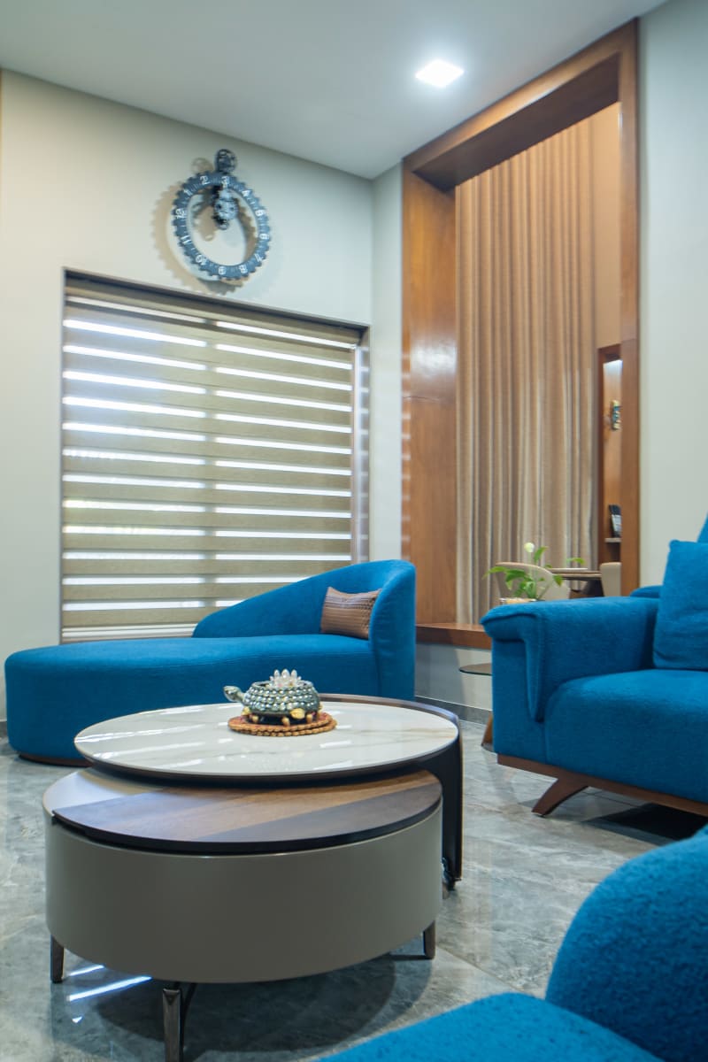 Blue seating and nested coffee tables