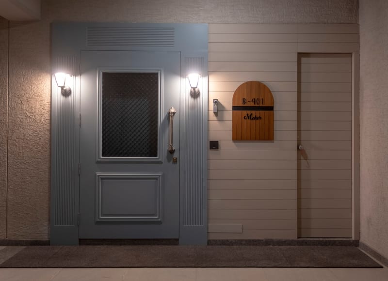 Main entrance door with nameplate and lights