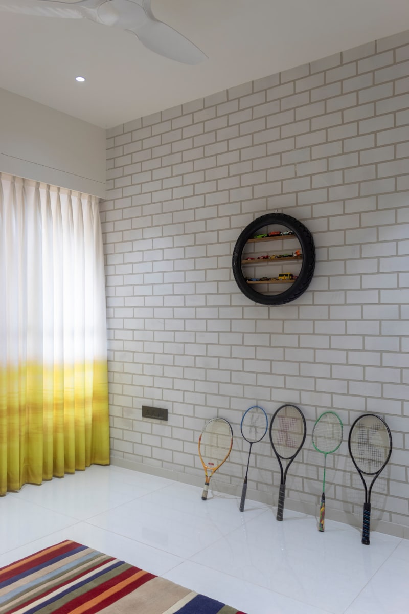 Kids playroom brick wall with sports rackets
