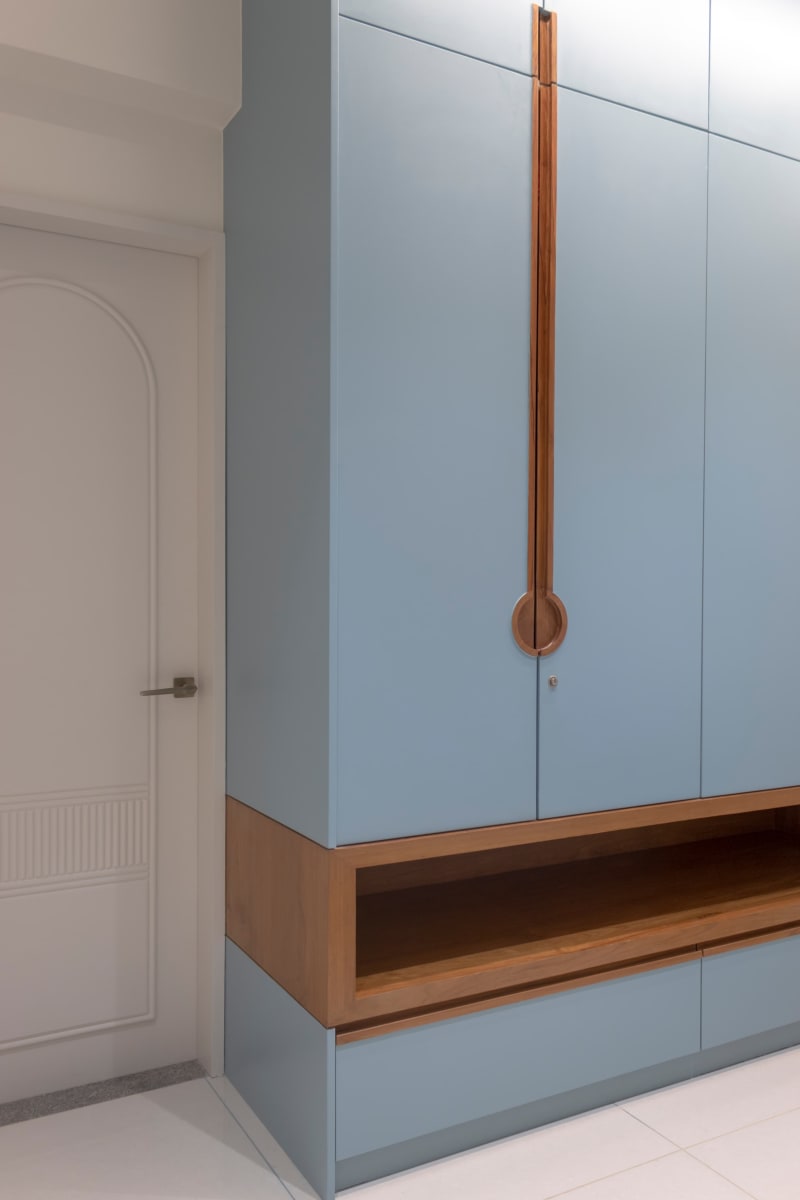 Blue bedroom wardrobe with wooden niche and door