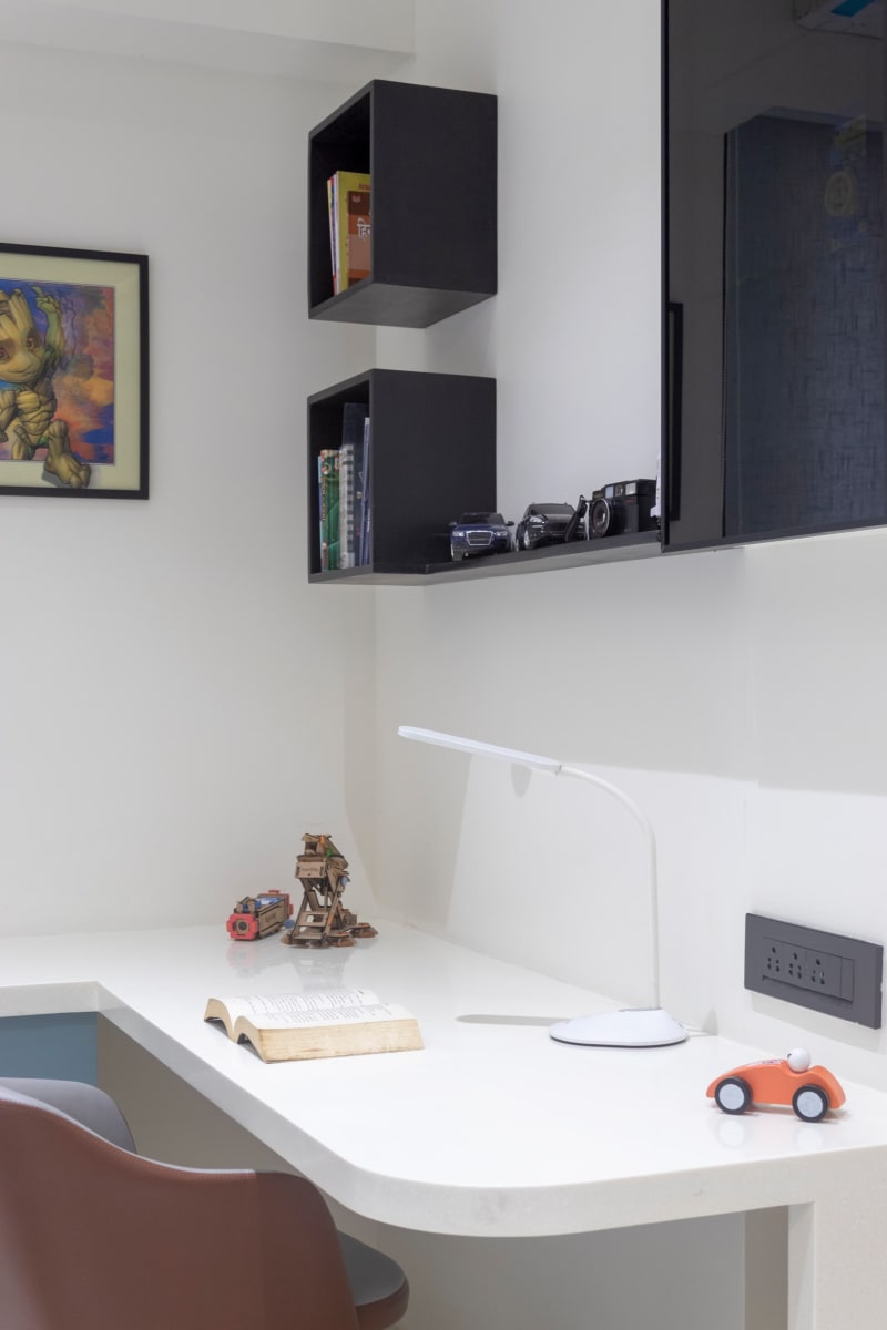 Modern study desk with desk lamp and shelves