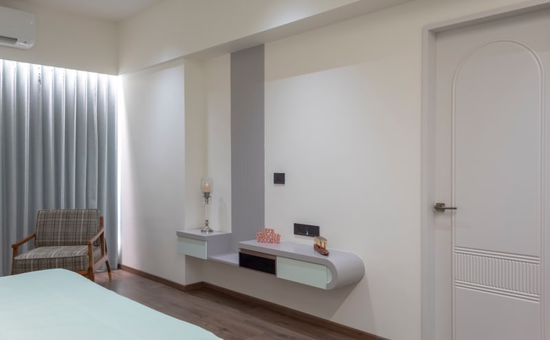 Bedroom wall console and armchair corner